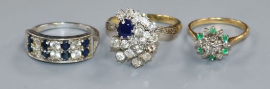 Three assorted 18ct gold and gem set dress rings including sapphire and diamond.