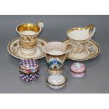 Two early 19th century Empire style coffee cups and a Berlin cup and saucer, and three porcelain