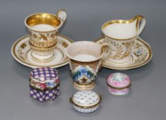 Two early 19th century Empire style coffee cups and a Berlin cup and saucer, and three porcelain