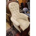 An early Victorian walnut show frame armchair