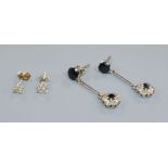 Two pairs of 9ct gold and gem set ear studs including diamond set.