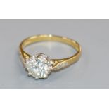 A diamond solitaire ring (approx 1.0ct), with diamond-set shoulders and 18ct gold shank, size L.