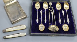 A silver mounted desk clip, two mother of pearl fruit knives including Victorian, a cased set of