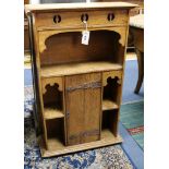 An Arts and Crafts oak bookcase W.57cm