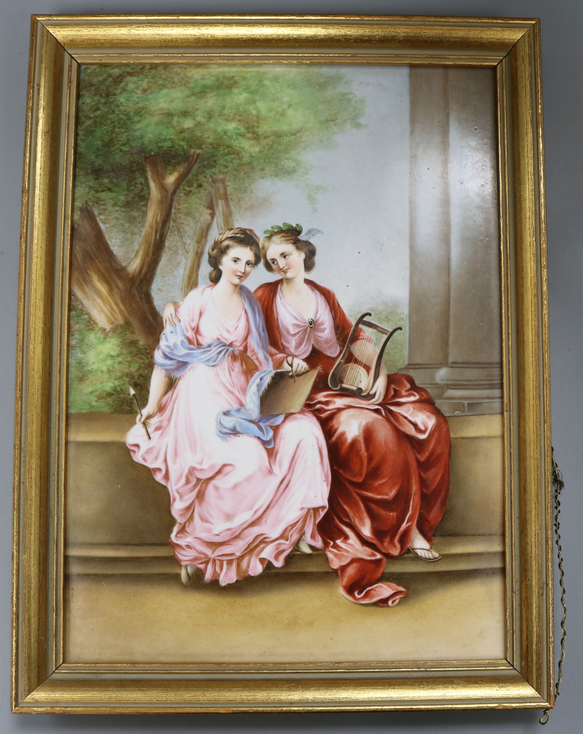 A painted porcelain plaque depicting seated females height 34cm incl. frame