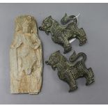 A Chinese stone fragment carved with a buddha in relief, possibly Jin Dynasty and a pair of small