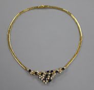 A modern 18ct gold sapphire and diamond cluster set necklace.