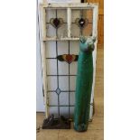 A stained glass window, gypsy folk art frog and railway rivet W.51cm