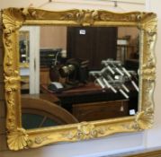 A carved giltwood hall mirror W.100cm