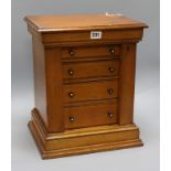 A Victorian oak miniature Wellington chest, fitted four drawers, H 39cm W 32.5cm D 26.5cm
