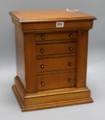 A Victorian oak miniature Wellington chest, fitted four drawers, H 39cm W 32.5cm D 26.5cm