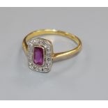 A 1920's/1930's 18ct gold and platinum ruby and diamond tablet ring, size M.