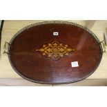 An Edwardian inlaid oval brass galleried tray 61cm long