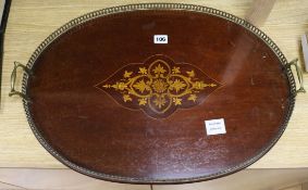 An Edwardian inlaid oval brass galleried tray 61cm long