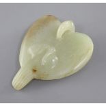 A Chinese yellow and russet jade carving of a falcon, Eastern Zhou dynasty or later, the stylised
