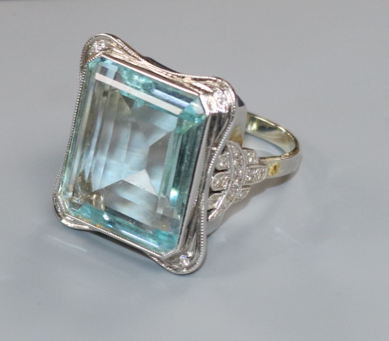 A large modern 9ct white gold and emerald cut aquamarine dress ring with diamond set shoulders, size - Image 2 of 2