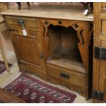 An Arts and Crafts oak sideboard W.122cm