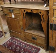 An Arts and Crafts oak sideboard W.122cm