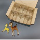 A boxed set of six Babycham glasses and two Bambi models
