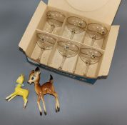 A boxed set of six Babycham glasses and two Bambi models