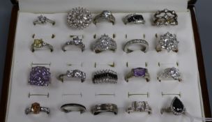 Twenty assorted modern 925 dress rings, in ring display box.