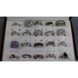 Twenty assorted modern 925 dress rings, in ring display box.