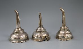 A George III silver wine funnel and two other Georgian silver wine funnels (a.f.).