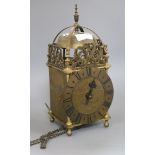 An early 20th century brass lantern clock, by Thos. Moore, Ipswich, with weight and pendulum. height