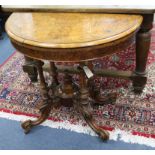 A Victorian walnut demi lune card table W.93cm