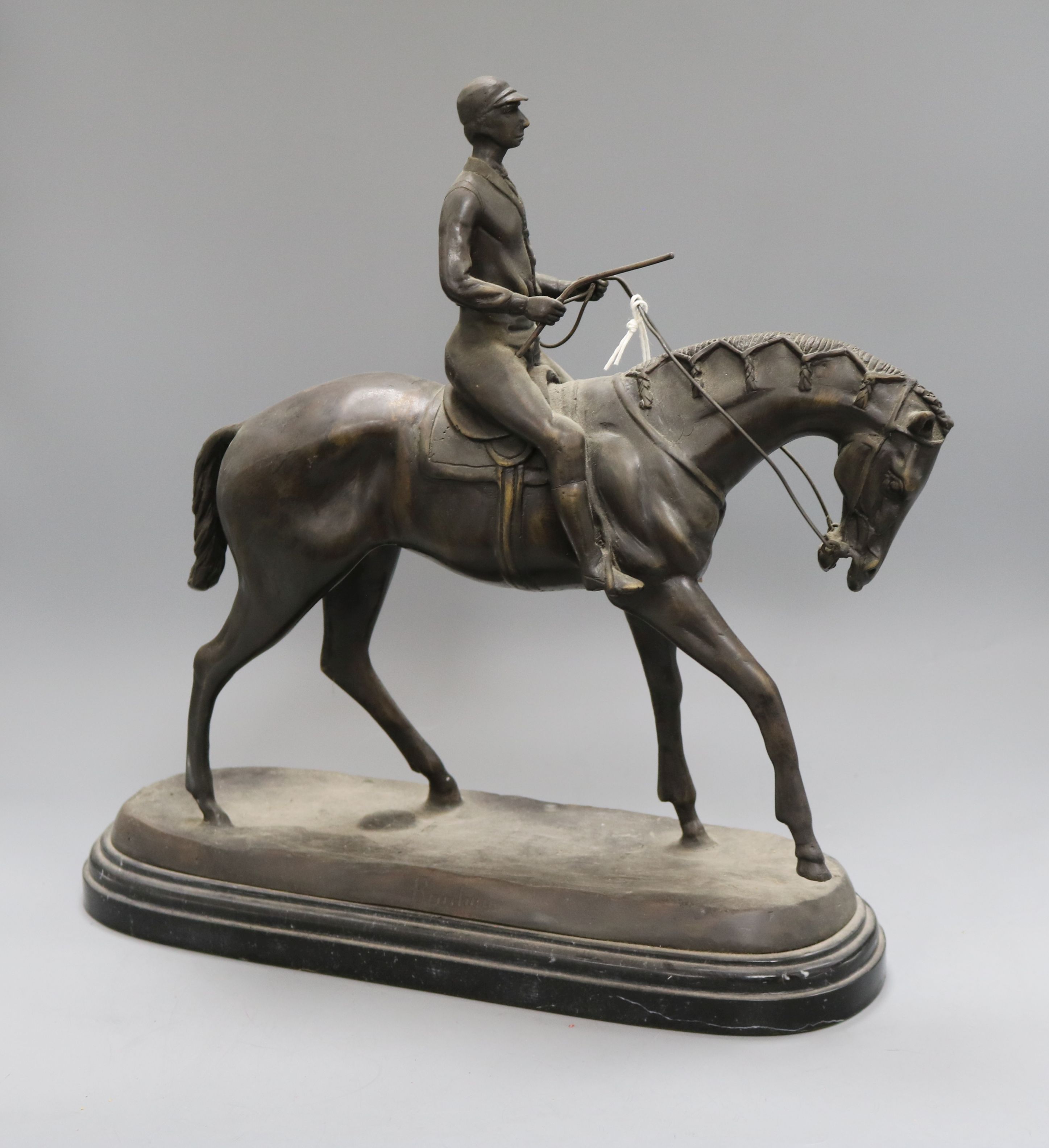 After Bonheur. A bronze jockey and rider height 40cm