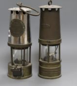 Two miner's lamps 25cm high