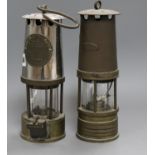 Two miner's lamps 25cm high