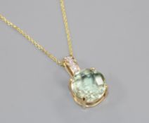 A 14ct gold, aquamarine? and diamond set pendant, on a 14ct gold fine link chain, pendant 19mm.