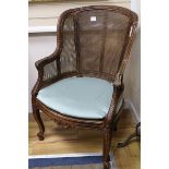 A French caned beech armchair
