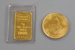 A gold 1/4 Krugerrand, a credit suisse 5g gold bar.