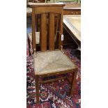 Four Liberty style oak and rush seat chairs