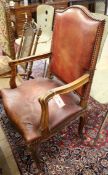 A leather seated French elbow chair