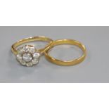 An 18ct gold and diamond cluster ring and a 22ct gold wedding band.