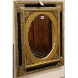 A Renaissance style wall mirror with oval plate W.57cm