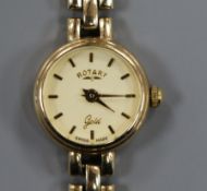 A lady's 9ct gold Rotary manual wind wrist watch, on a 9ct gold bracelet.
