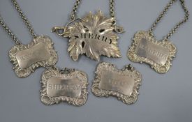 Four assorted Georgian Scottish silver wine labels and a late William Iv silver wine label.