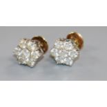 A pair of 18ct gold and seven stone diamond cluster ear studs.