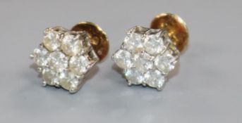 A pair of 18ct gold and seven stone diamond cluster ear studs.