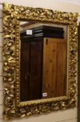 A Florentine framed mirror W.63cm