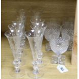 A set of twelve William Yeoward panel-cut champagne flutes and five heavy cut-glass goblets
