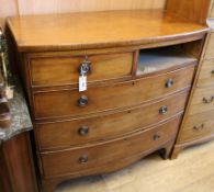 A Regency bow front chest of drawers (one top drawer missing) W.101cm