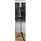 A pair of wrought iron candlesticks H.143cm