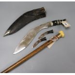 A malacca walking cane and a kukri knife in leather sheath the cane with presentation gilt band