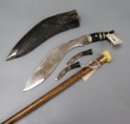 A malacca walking cane and a kukri knife in leather sheath the cane with presentation gilt band