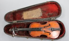 A cased model of a violin Violin 24cm long